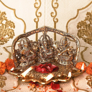 
                  
                    Klassic Laxmi Ganesh Saraswati Idol 5 Face Diya Oil Lamp Deepak Metal Showpiece Statue Traditional Diya for Diwali Puja , Home Decoration ( Pack of 1 , Gold )
                  
                