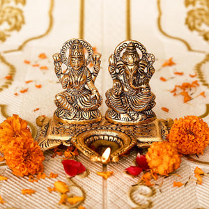 
                  
                    Klassic Ganesha & Laxmi Idol Oil Lamp Diya|Diwali Diya for Puja Diwali Gift Home Temple Articles Decoration Gifts|(Pack of 1,Golden)
                  
                