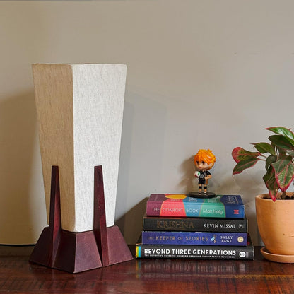 Lexton Wooden Pyramid Table Lamp (14-inch). Designed with a stylish pyramid-shaped wooden base, this lamp blends modern aesthetics with timeless charm, making it a perfect décor piece for bedrooms, living rooms, and office spaces.