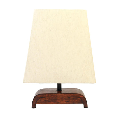 Table lamp with a wooden base and beige fabric shade on a white background
