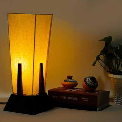 Lexton Wooden Pyramid Table Lamp (14-inch). Designed with a stylish pyramid-shaped wooden base, this lamp blends modern aesthetics with timeless charm, making it a perfect décor piece for bedrooms, living rooms, and office spaces.