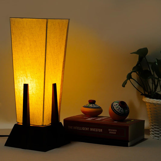 Lexton Wooden Pyramid Table Lamp (14-inch). Designed with a stylish pyramid-shaped wooden base, this lamp blends modern aesthetics with timeless charm, making it a perfect décor piece for bedrooms, living rooms, and office spaces.