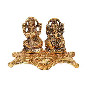 
                  
                    Klassic Ganesha & Laxmi Idol Oil Lamp Diya|Diwali Diya for Puja Diwali Gift Home Temple Articles Decoration Gifts|(Pack of 1,Golden)
                  
                