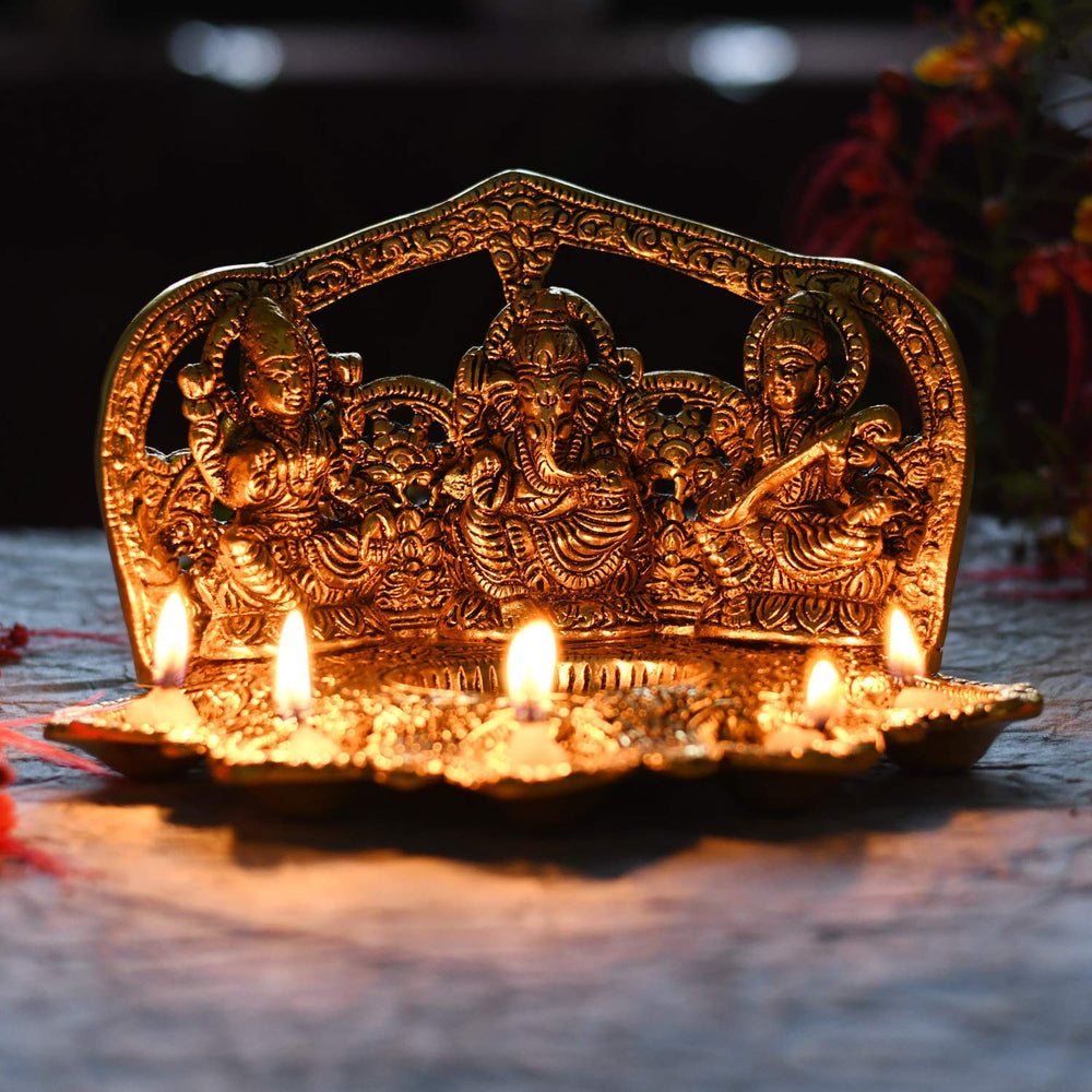 
                  
                    Klassic Laxmi Ganesh Saraswati Idol 5 Face Diya Oil Lamp Deepak Metal Showpiece Statue Traditional Diya for Diwali Puja , Home Decoration ( Pack of 1 , Gold )
                  
                